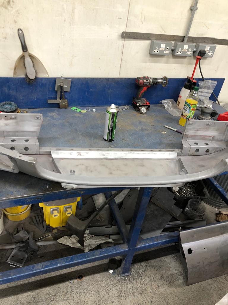 26052021 White jaguar etype roadster inconsistencies in the front over riders that needed addressing to obtain symmetry and leading the spot welded joints on the shell 34 1