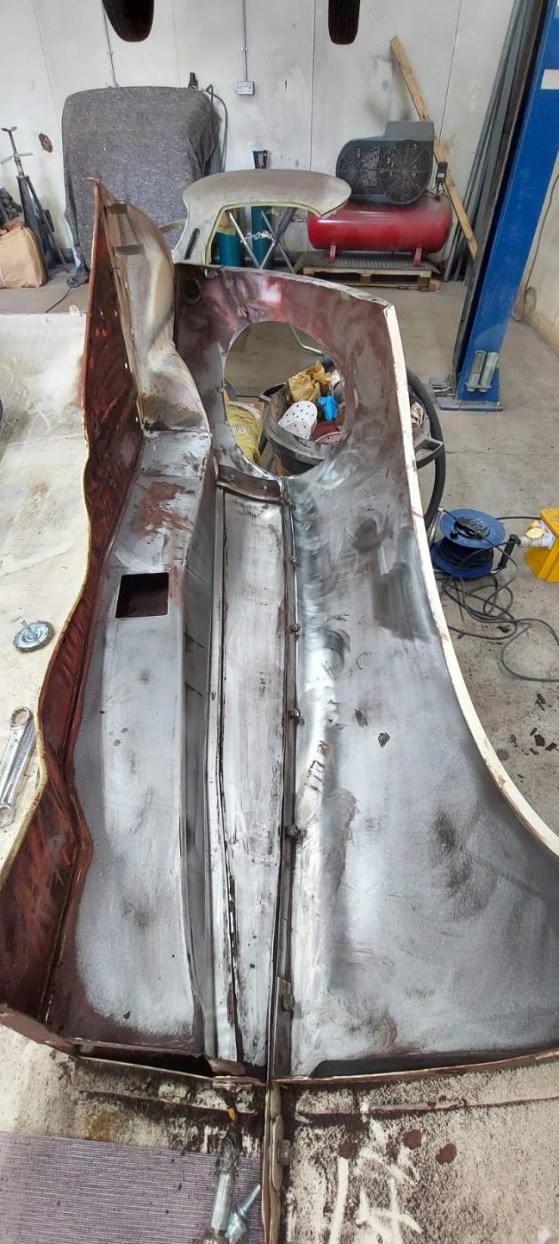 03062021 White etype bonnet rubbed and primed. wheel arch sttripped and undersealed 13 1