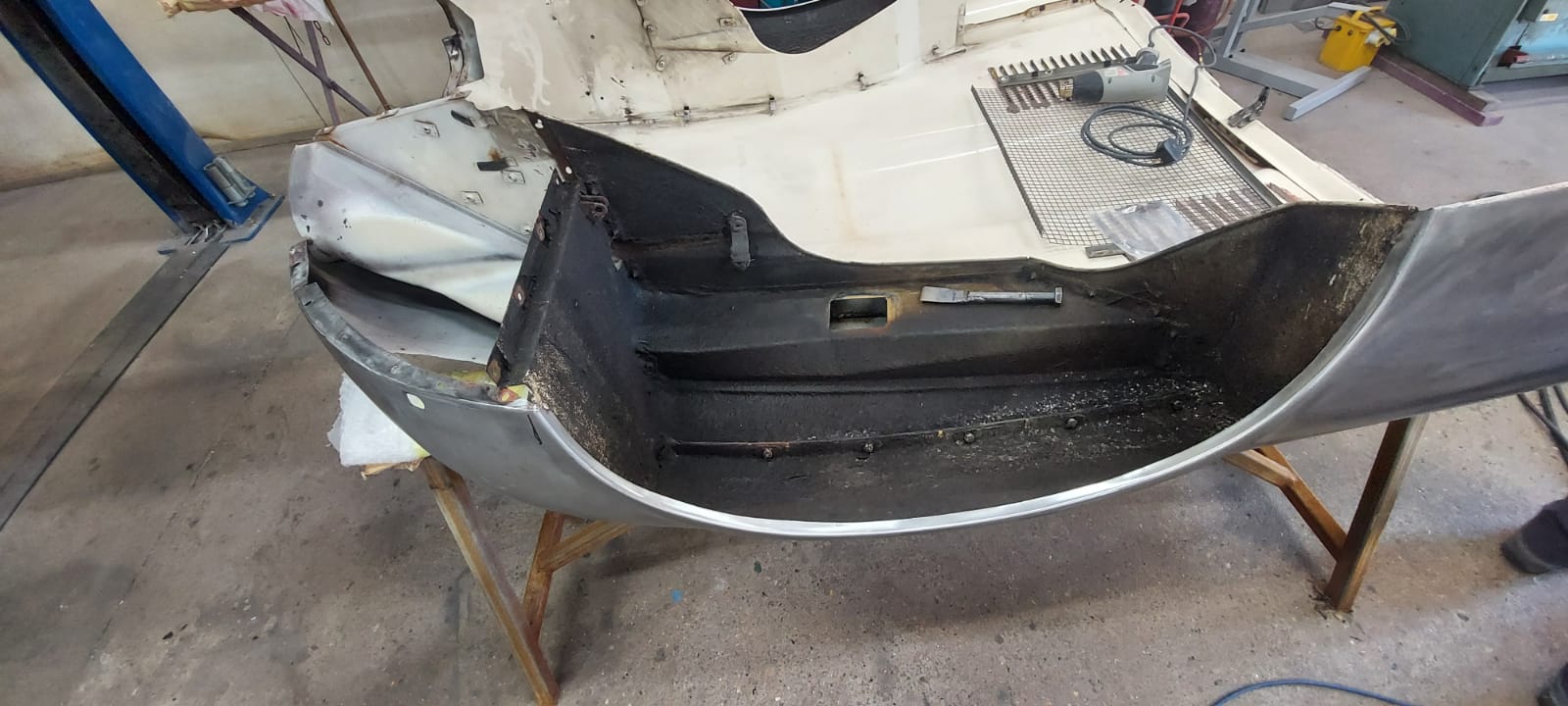 03062021 White etype bonnet rubbed and primed. wheel arch sttripped and undersealed 6 1