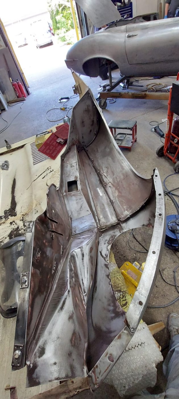 03062021 White etype bonnet rubbed and primed. wheel arch sttripped and undersealed 8 1