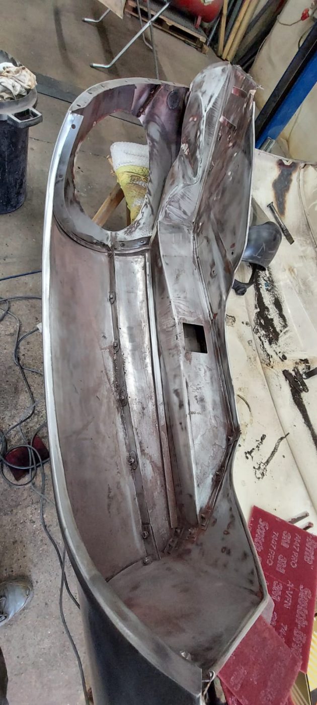 03062021 White etype bonnet rubbed and primed. wheel arch sttripped and undersealed 9 1