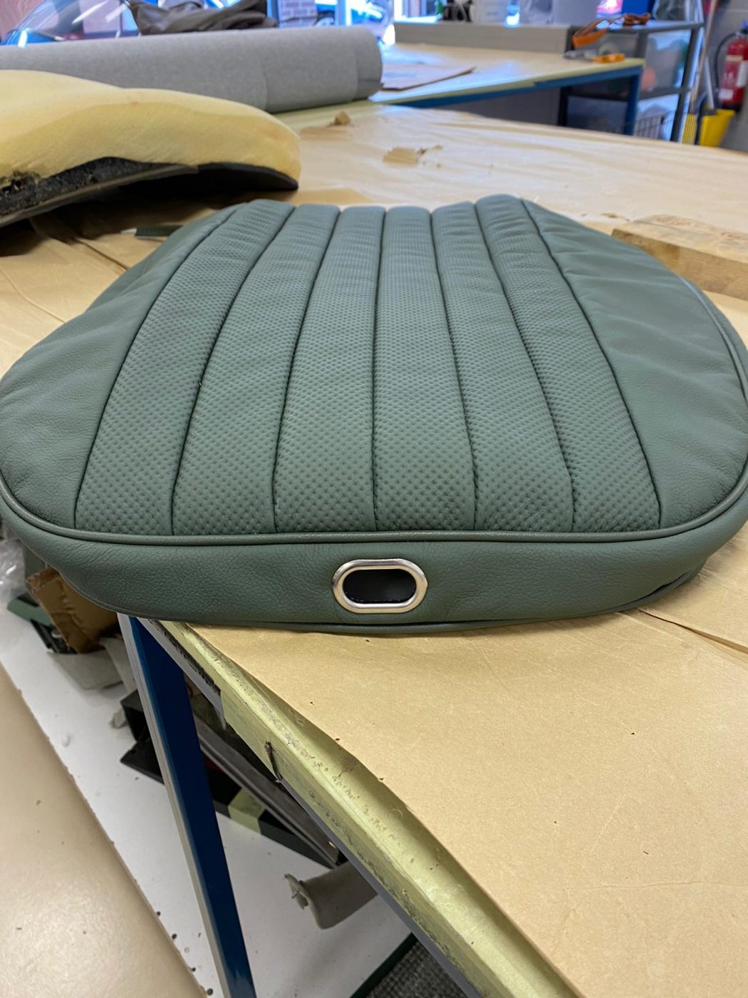17062021 Jag E Type whitecutting headrest hole in seat squab coverfitting chrome trim into place 3 1