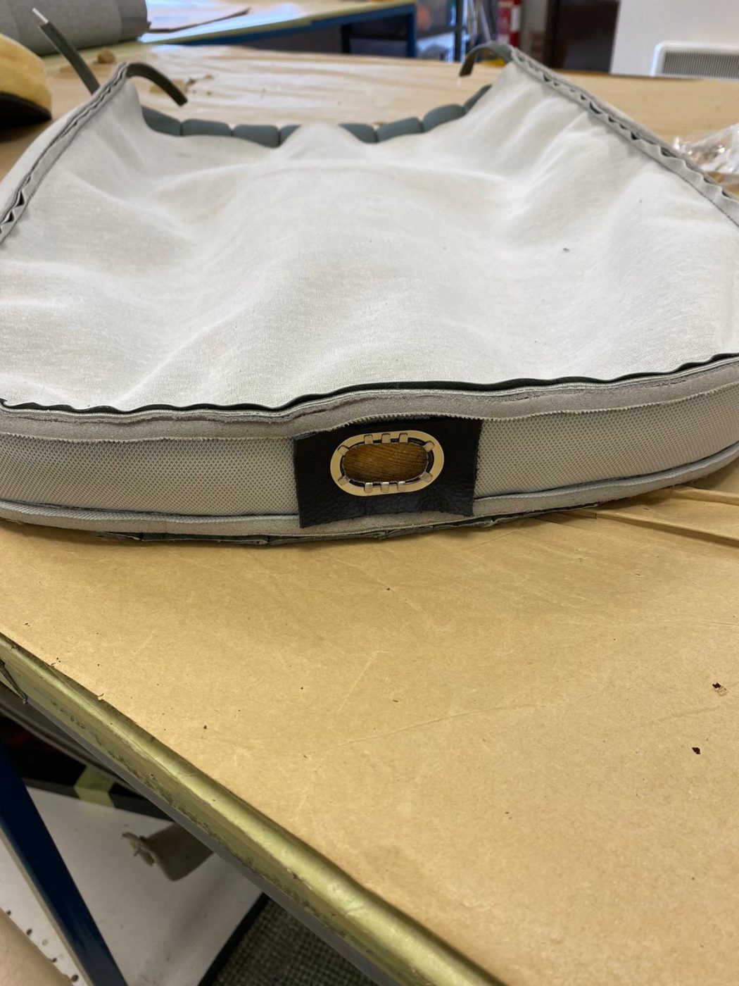 17062021 Jag E Type whitecutting headrest hole in seat squab coverfitting chrome trim into place 4 1