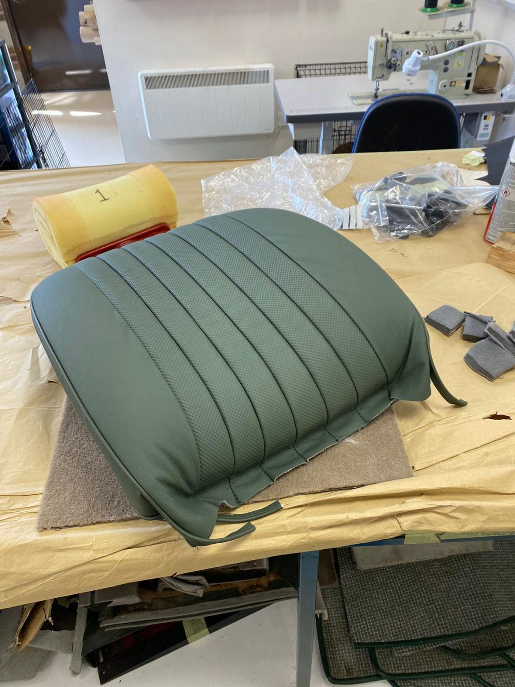 17062021 Jag E Type whitecutting headrest hole in seat squab coverfitting chrome trim into place 6 1