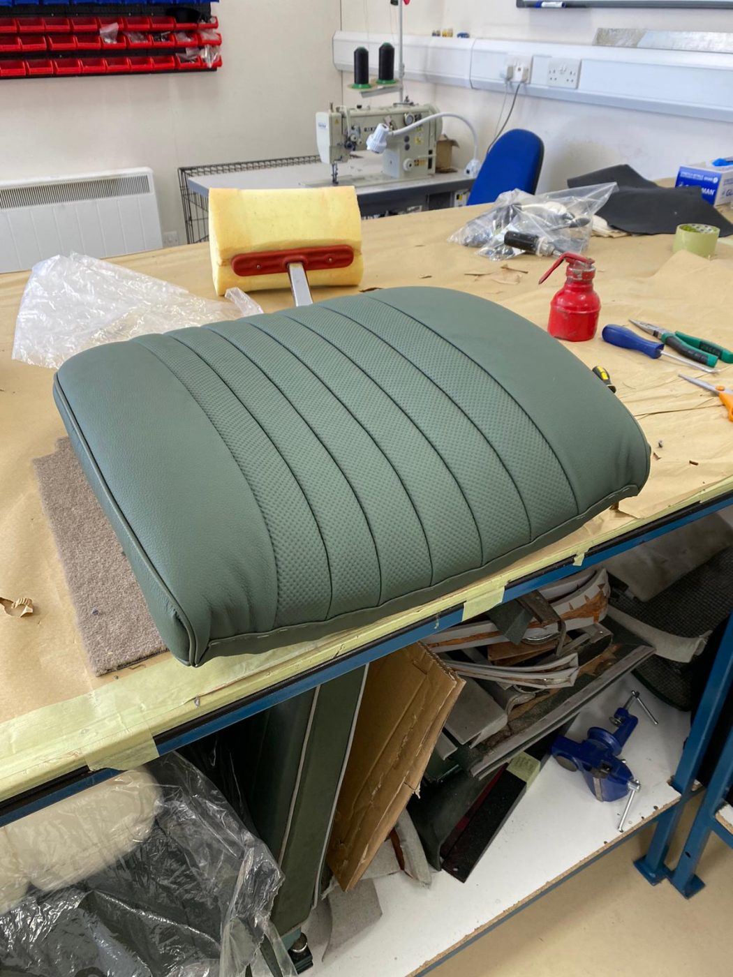 17062021 Jag E Type whitecutting headrest hole in seat squab coverfitting chrome trim into place 8 1 1
