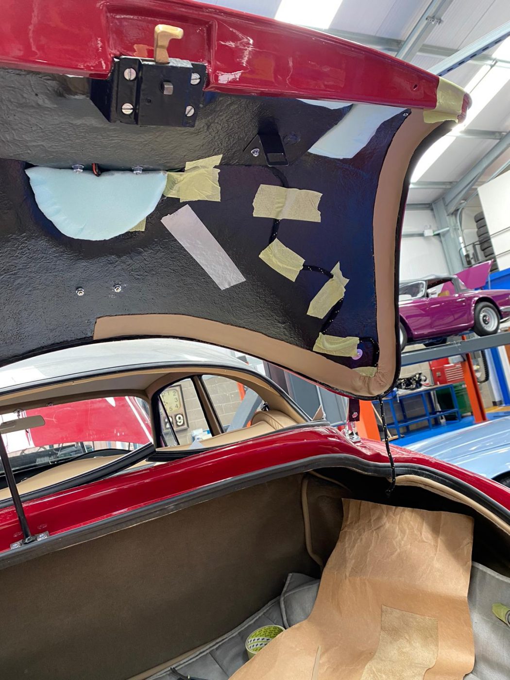 30062021 Jensen Redcutting glueing leather strip around inside edge of boot lid 1 1