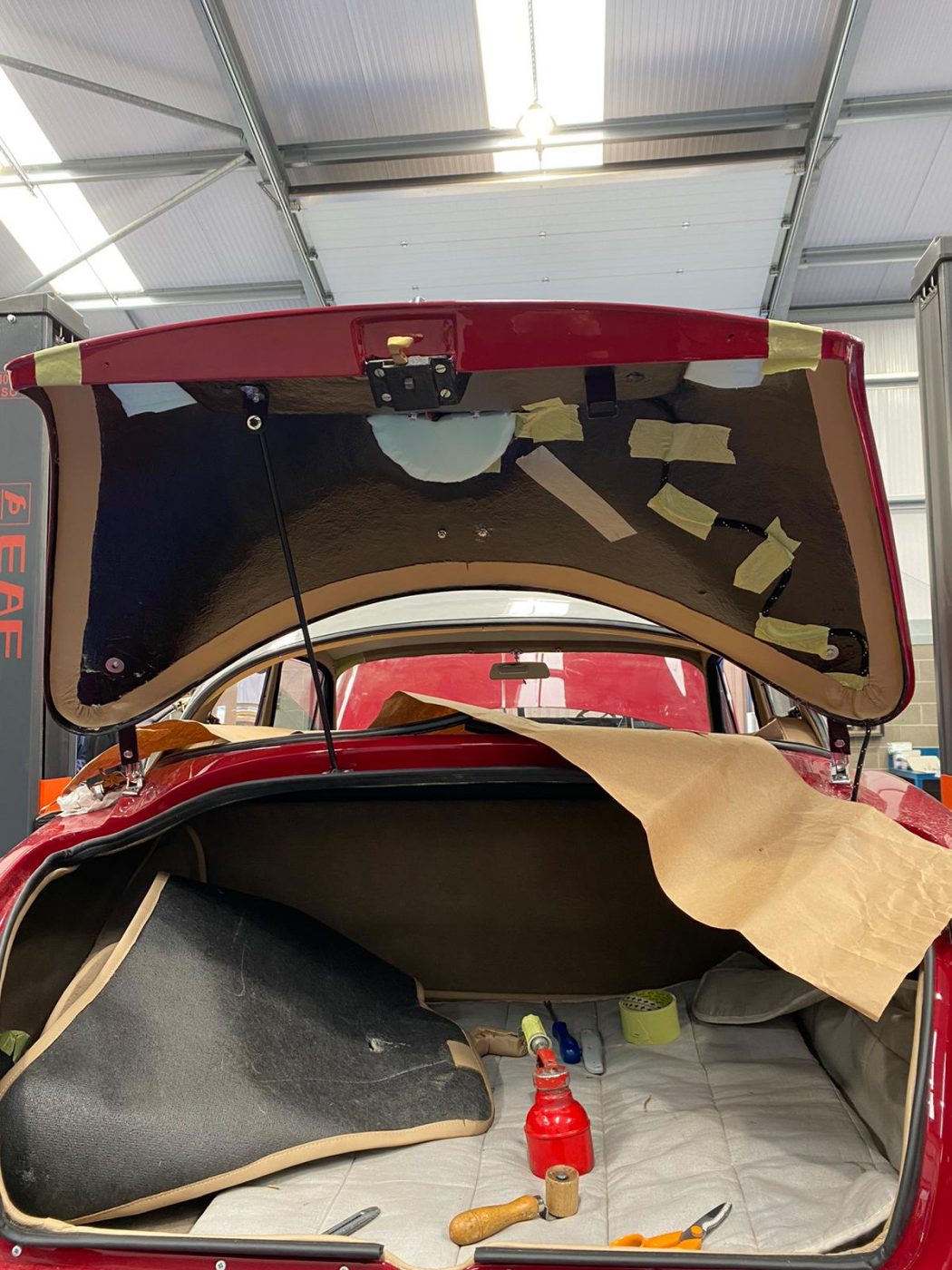 30062021 Jensen Redcutting glueing leather strip around inside edge of boot lid 2 1