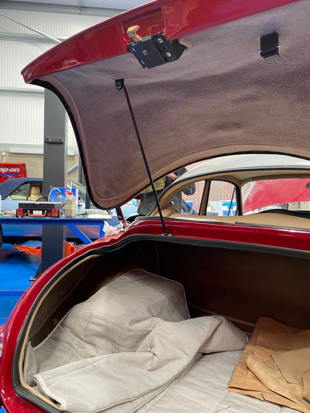 30062021 Jensen Redcutting glueing leather strip around inside edge of boot lid 3 1