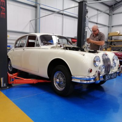 1963-white-Jaguar-Mk-II-3.4-putting-everything-back-into-the-engine-bay-after-painting-1