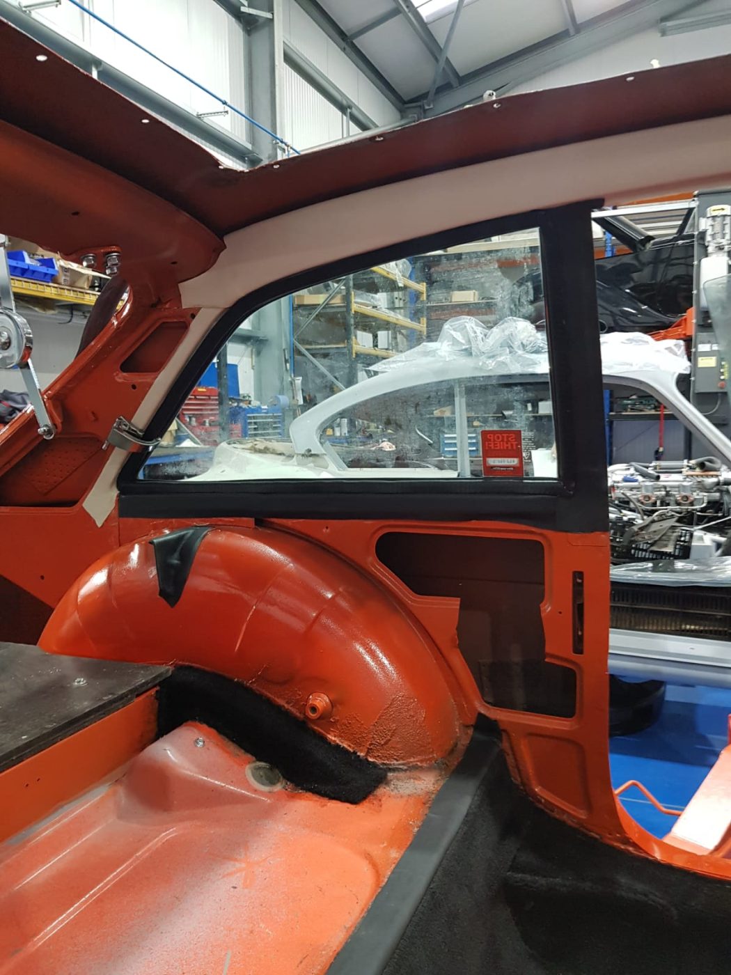 220922 MG B GT Blaze carpet and trim going in 5 1