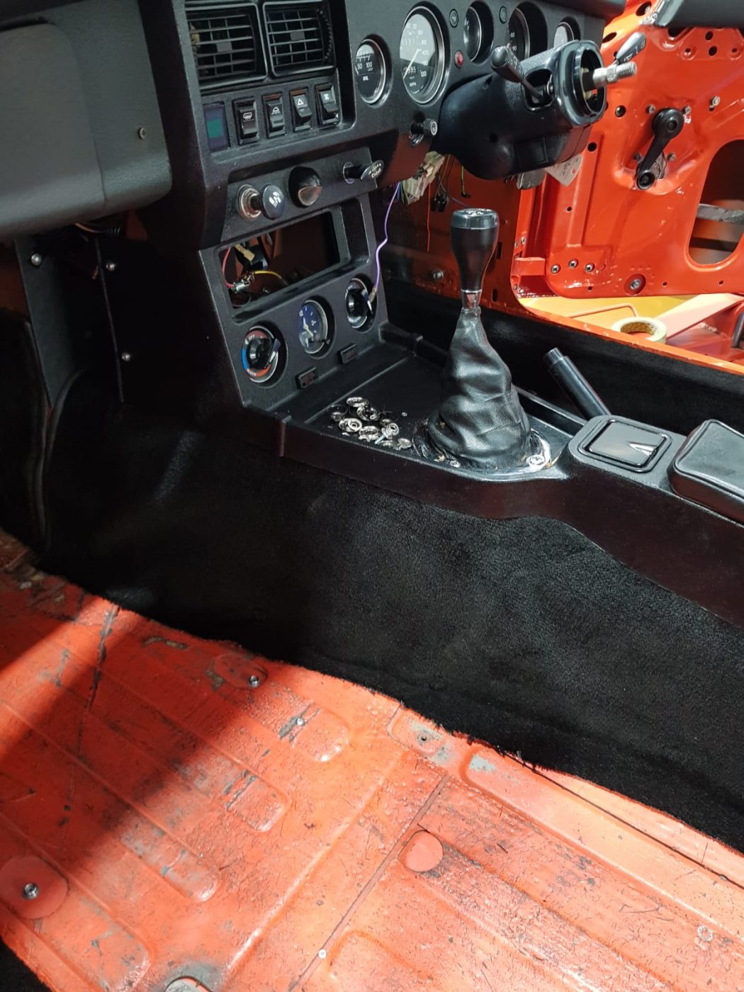 220922 MG B GT Blaze carpet and trim going in 8 1