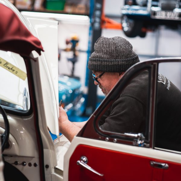 Classic car technician John working on Morris Minor 1000