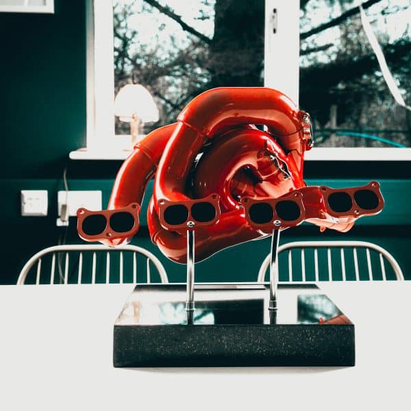 red manifold sculpture