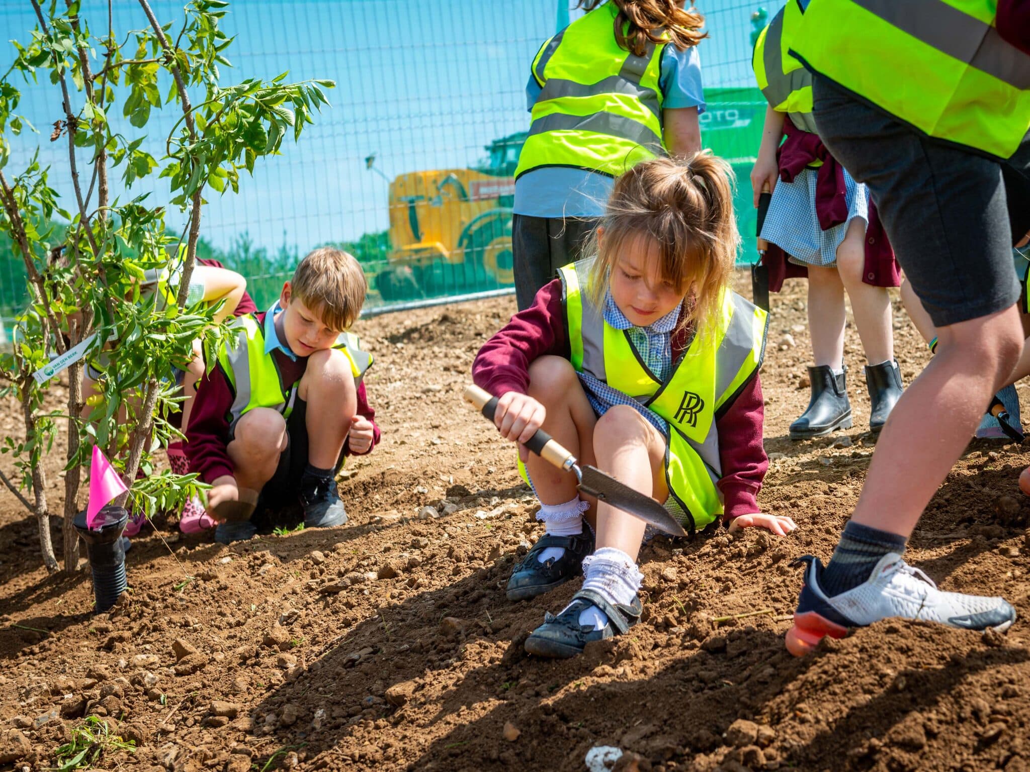 Local schoolchildren plant first new tree on Rolls Royce extension site 3 scaled