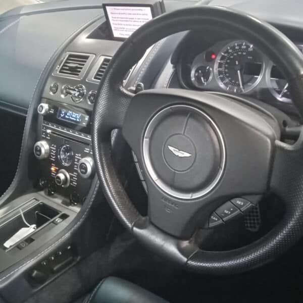 07.08.2025 2009 Aston Martin AMV8 Vantage Convertible Silver PDI 3