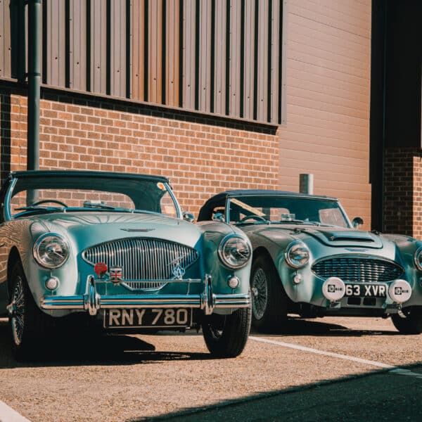 180326 1955 Austin Healey 100 1960 Austin Healey 3000 Outside Workshop