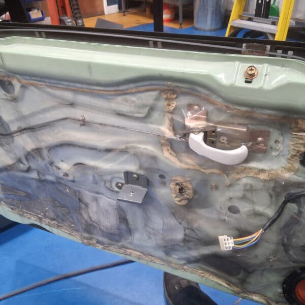 260326 1991 Nissan Figaro Windscreen trims wheel arch and door cards removed 8