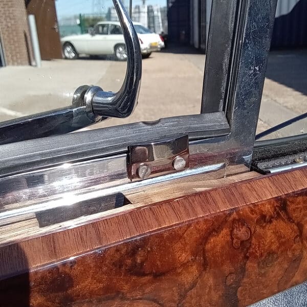 230426 1959 Jaguar MkIX OF Quarter Window Striker 4