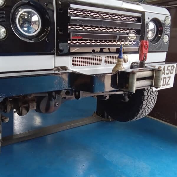 300526 2008 Land Rover Defender Pickup Front Bumper Winch and Wiring Removal 3